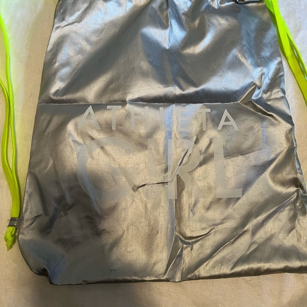 Athletta girl silver and neon green  cinch sack. Used, but life left in it.